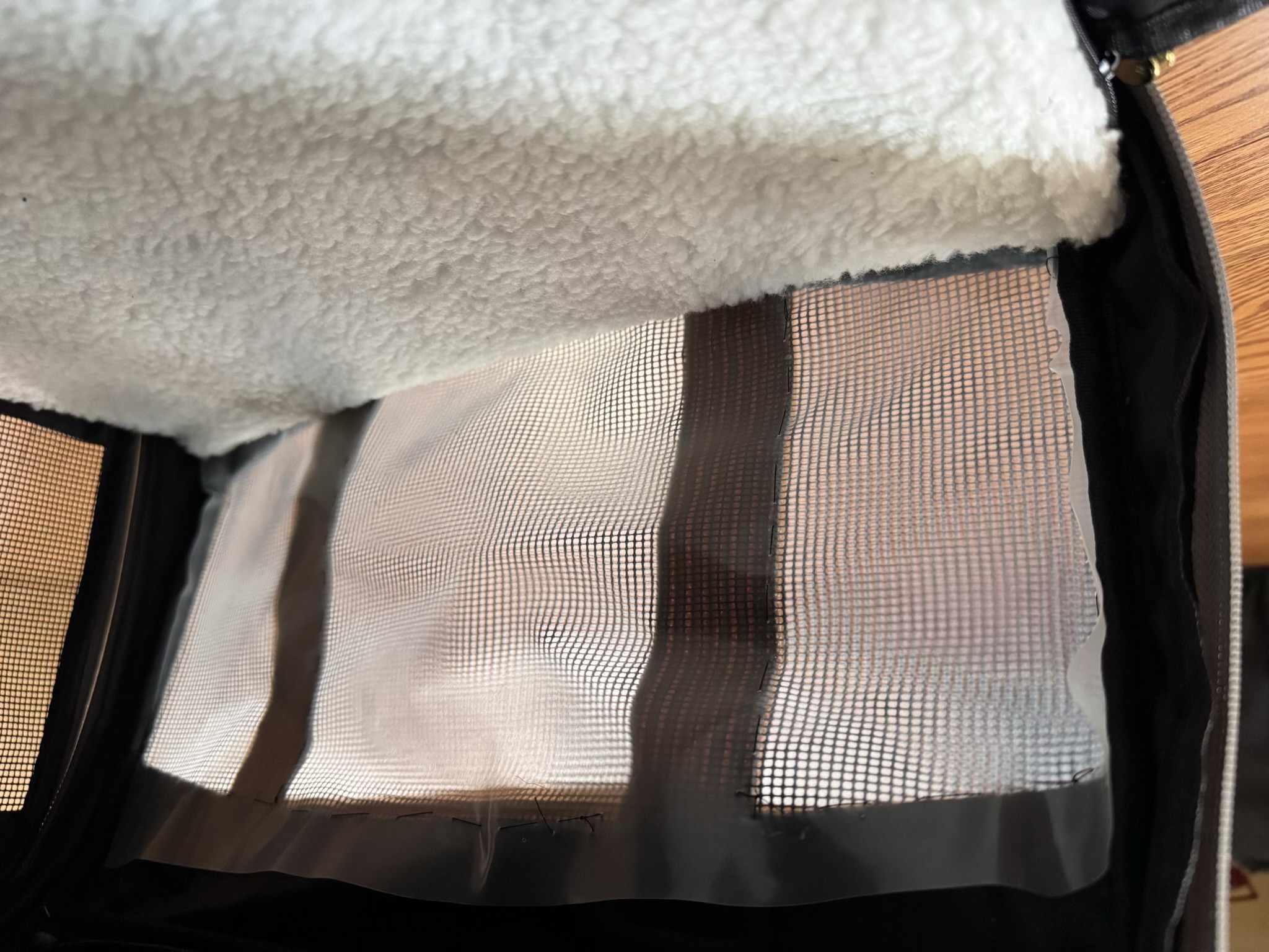 An interior view of the long side panel, covered in translucent plastic.